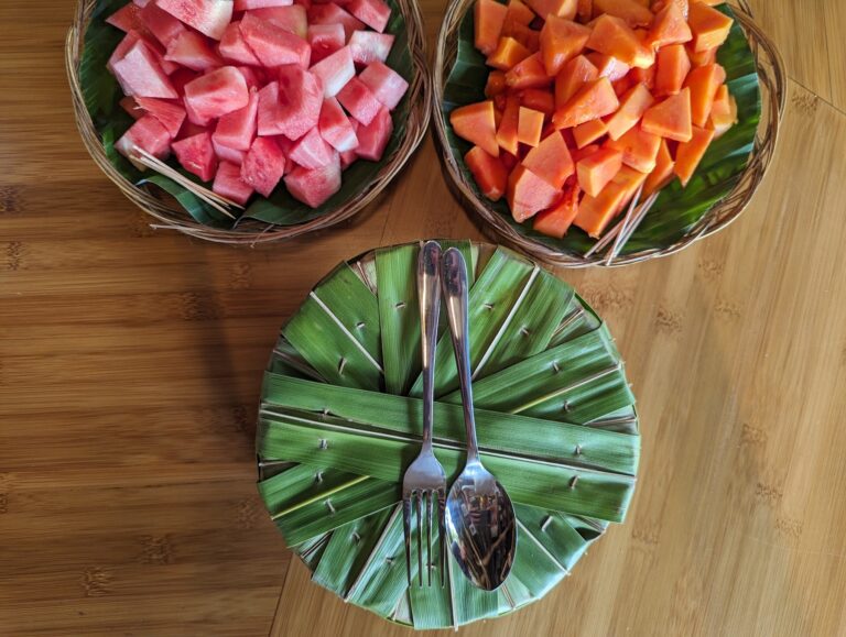 watermelon and papaya in banana leaf bowls