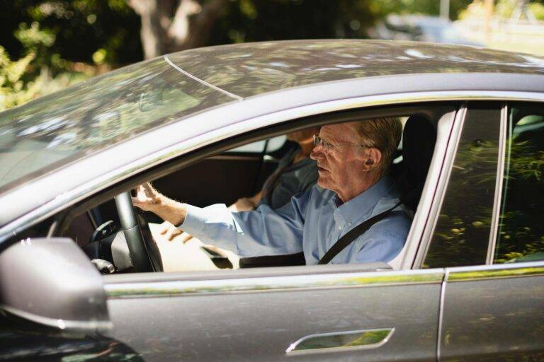 Ed Begley Jr driving Tesla.