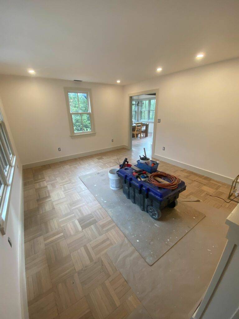 Bea's Living room, mostly tidied after painting the walls Creamery White and the window/door trim Met Grey.