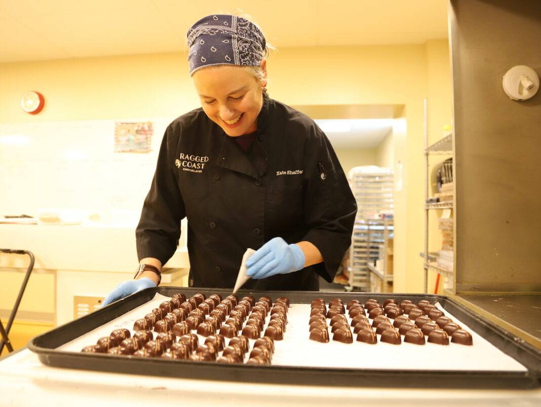 Women making local and fresh chocolates in kitchen in Maine