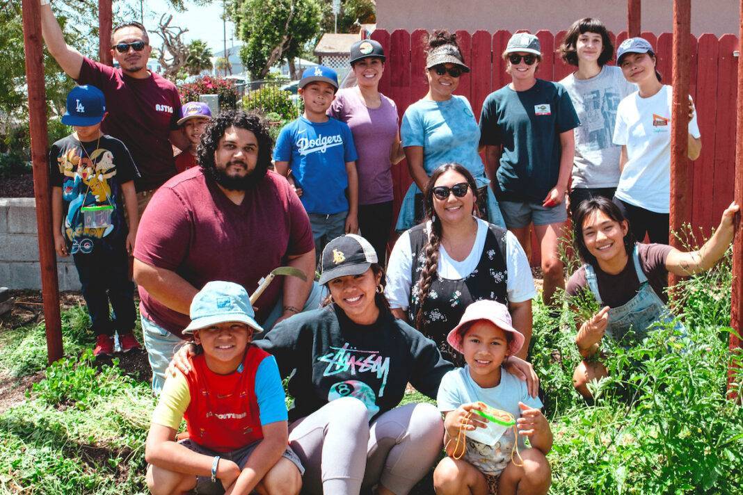 Group of people outside in a community garden