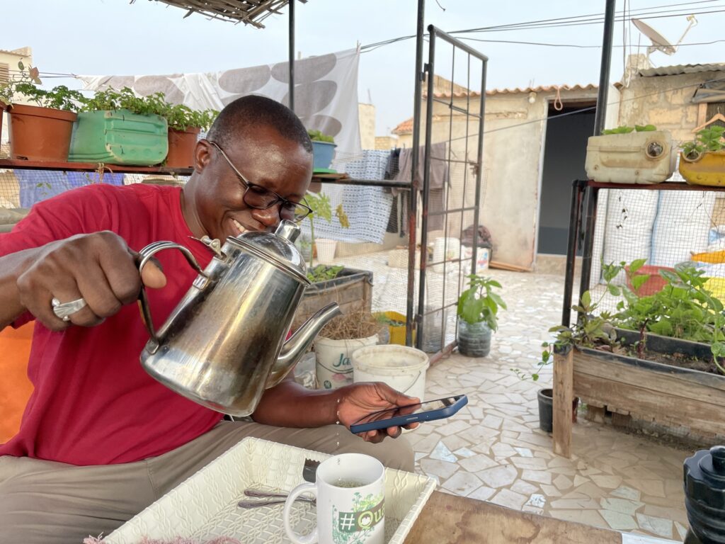 man pouring tea